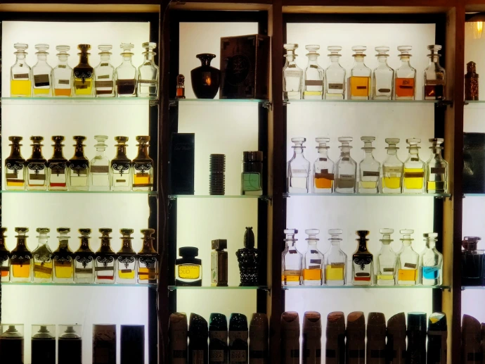 bottles on brown wooden shelf